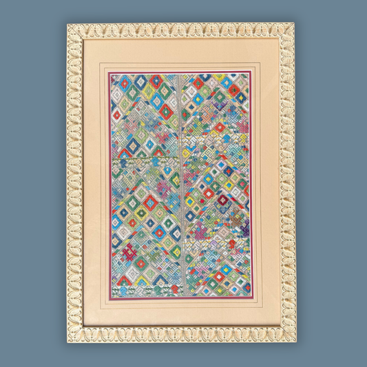 Framed geometric patterned handwoven textile on a blue background