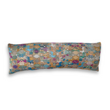 Long, rectangular pillow with a multicolored geometric pattern on a white background