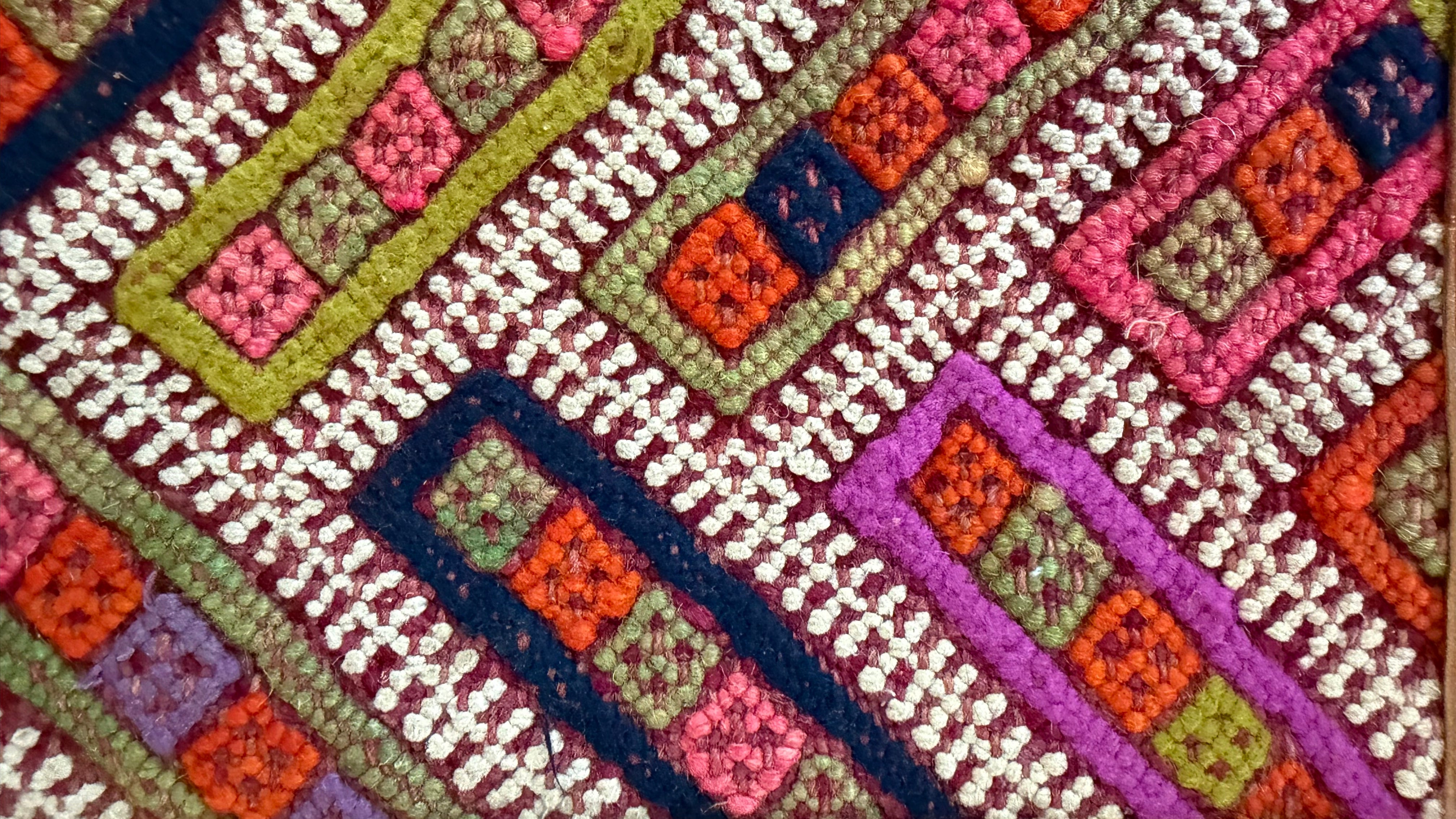 Close-up of a colorful Kilim rug with geometric pattern - this kilim was used to make our kilim crossbody