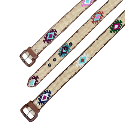 Beige belt with colorful geometric patterns and brown leather straps on a white background