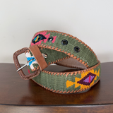 Green belt with colorful fish pattern on a wooden surface