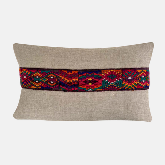 Hemp pillow with horizontal multicolor accent stripe on light gray background - Intertwined: Handmade for Good