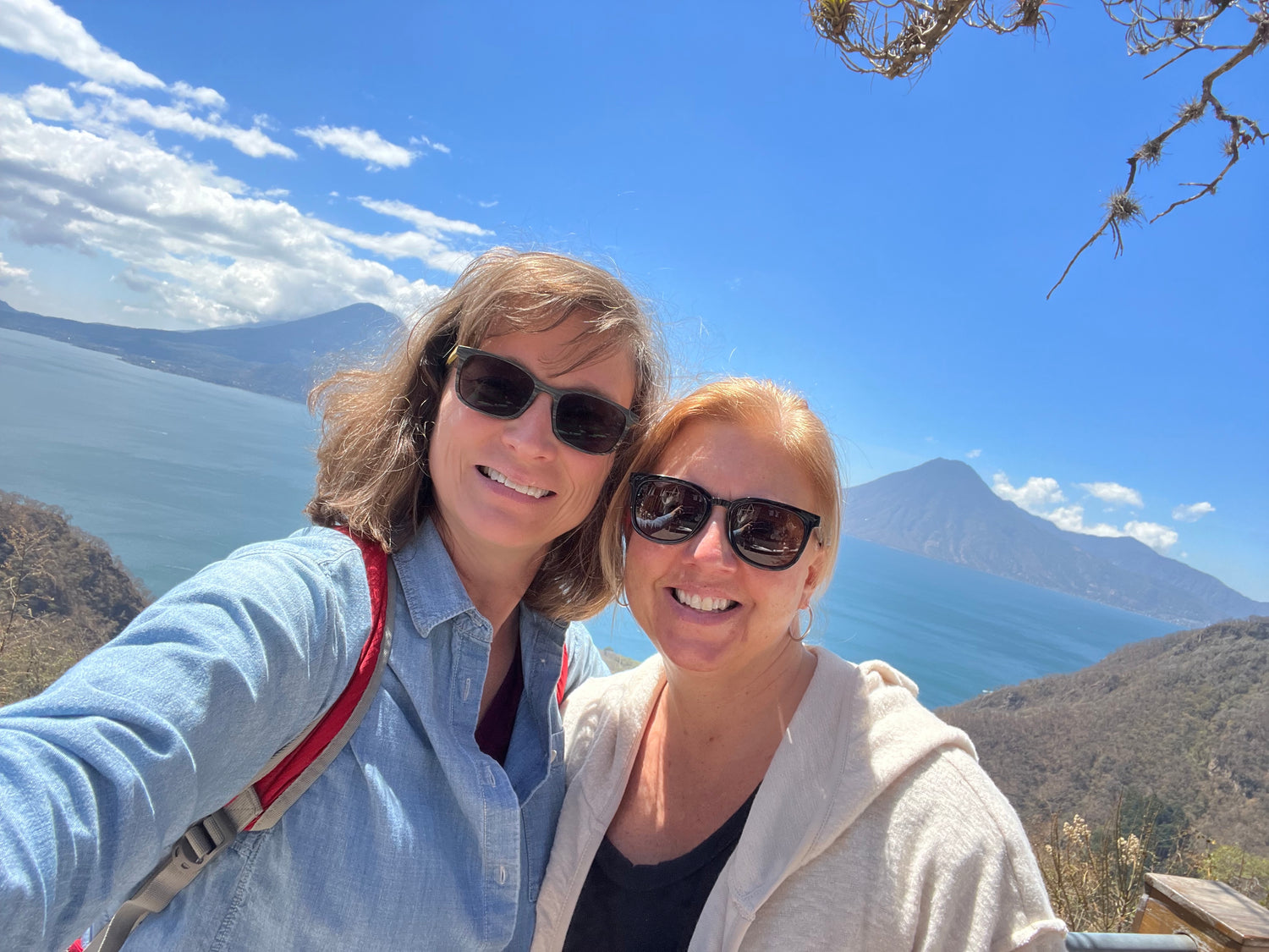 Ginger Shields and Tiffany Vestal, co-founders of Intertwined, in front of Lake Atitlan in Guatemala