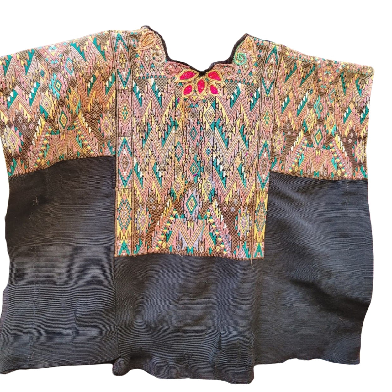 Traditional embroidered garment with a black base on a white background