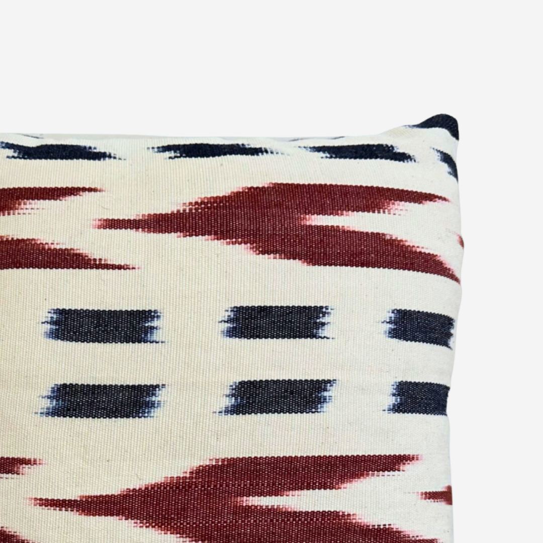Close up of jaspe pillow with fringe, white with brown and black accents - Intertwined: Handmade for Good.