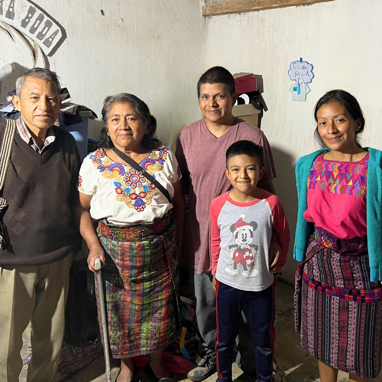 Guatemalan artisans from the Ruth & Naomi cooperative pose for a photo. Tomasa is the leader in her village for the making of cotton corte blankets.