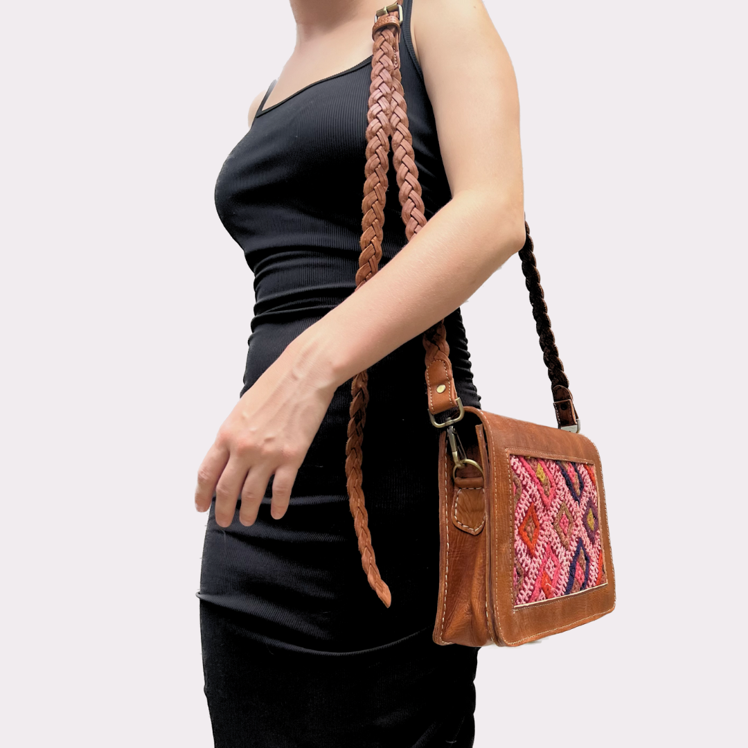 Model with Intertwined: Handmade for Good's Kilim Front Crossbody over shoulder. 