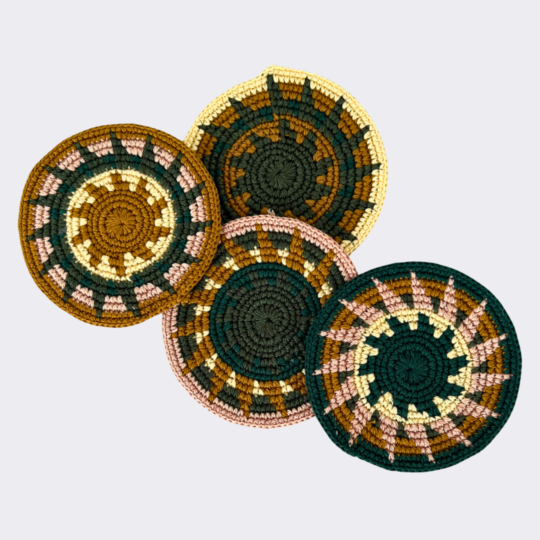 Green and gold crocheted coasters on a light gray background - Intertwined: Handmade for Good