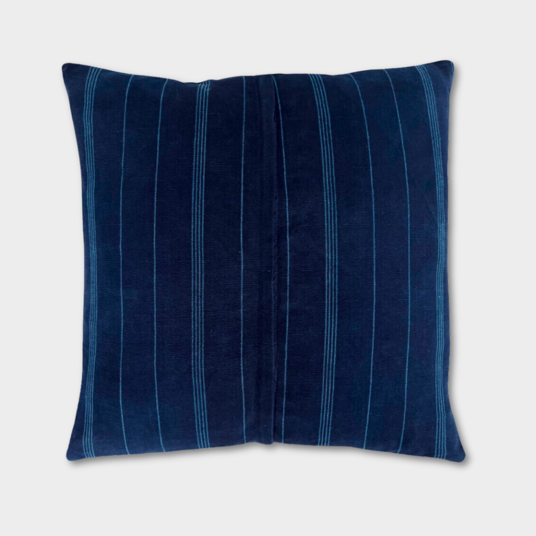Back side of an indigo corte pillow, zipper down middle. 