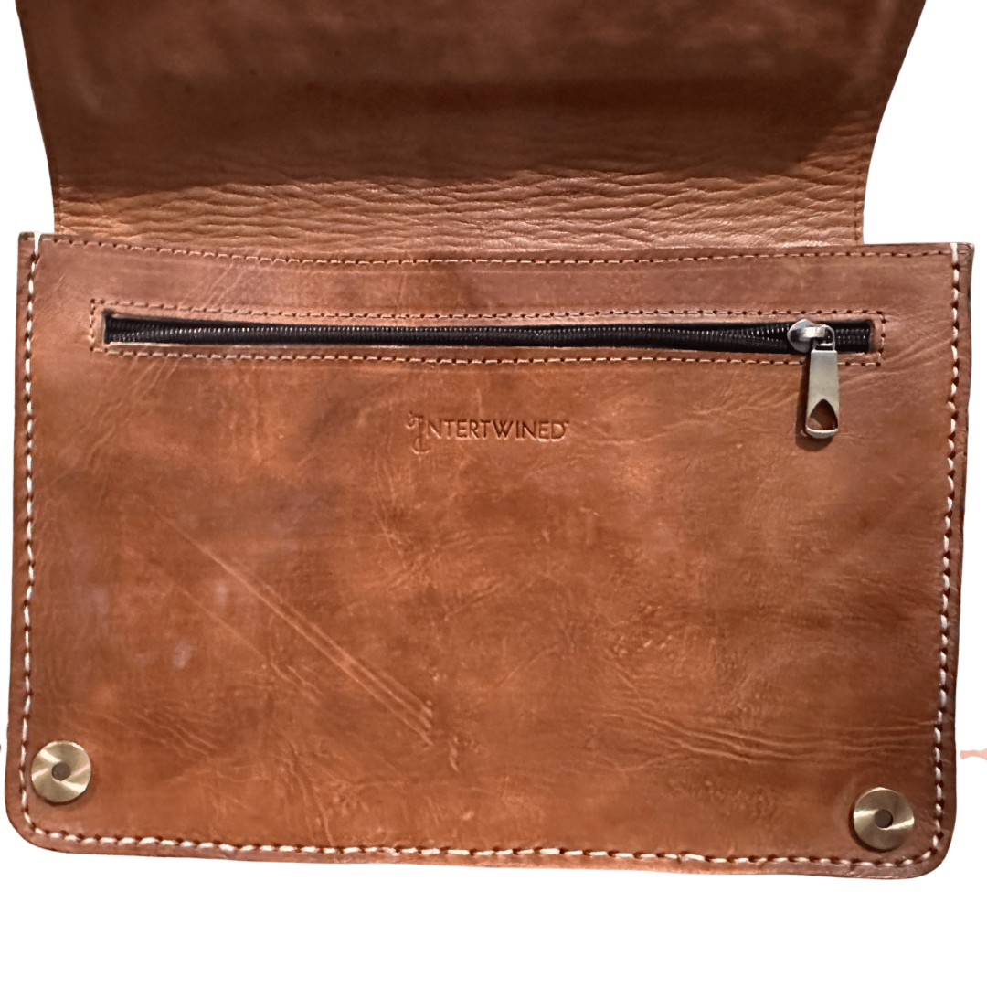 View of the leather interior of Intertwined: Handmade for Good's Kilim Front Crossbody.
